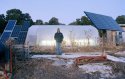 Leon Smith in front of his greenhouse